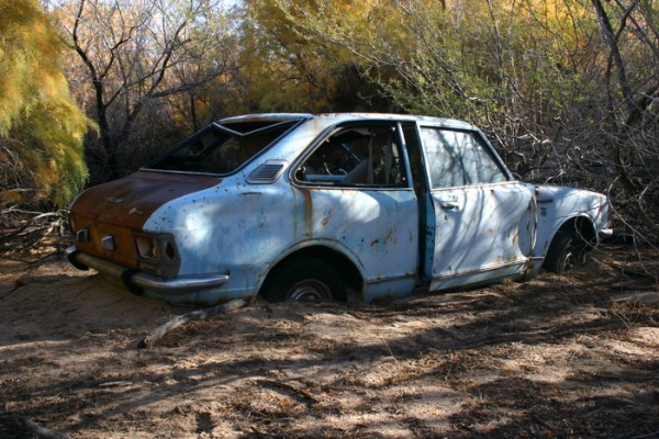 Side view of Mel's new car.  It's a 1971 Toyota Carrola Deluxe!  Great car, just needs a little cosmetic work!
